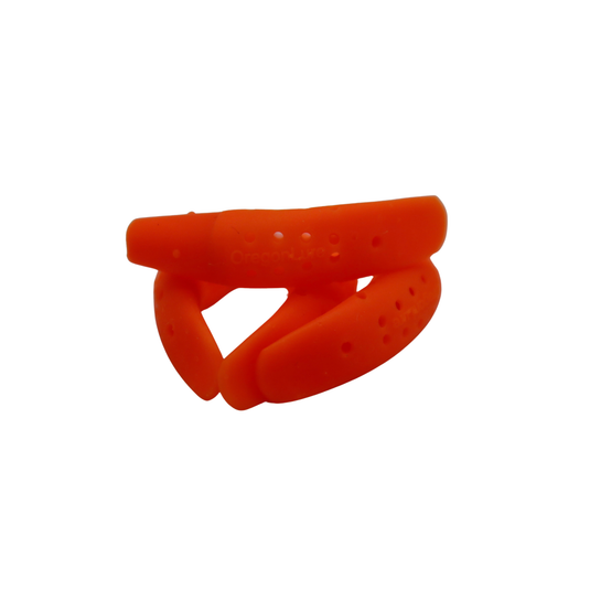 A Orange wobbling trout fishing lure with a built in scent chamber