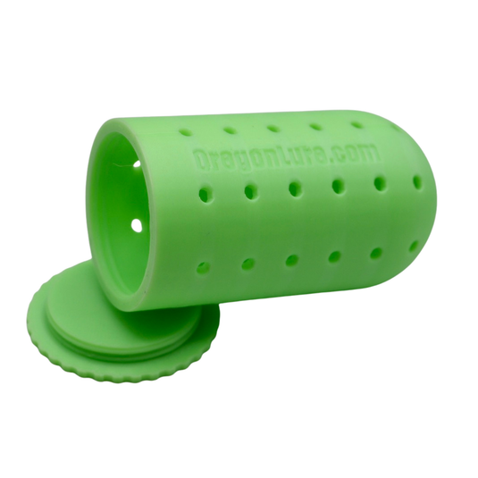 A Green Glow halibut fishing lure for holding scent and bait.