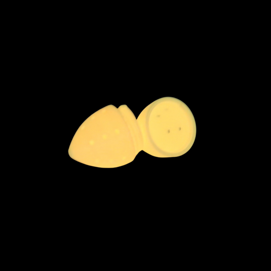 A small Orange Glow in the dark halibut fishing lure for holding scent and bait.