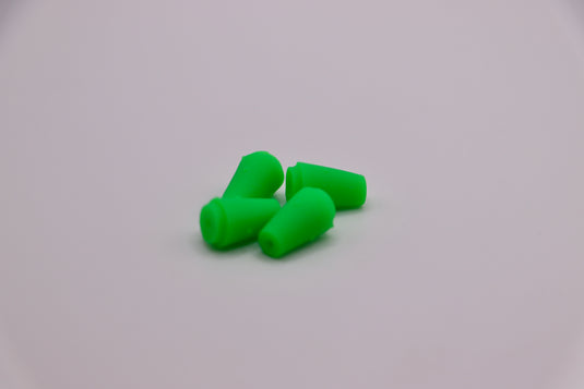 Fresh water lure tails in neon green - used as bass lure, trout lure, and walleye fishing tackle