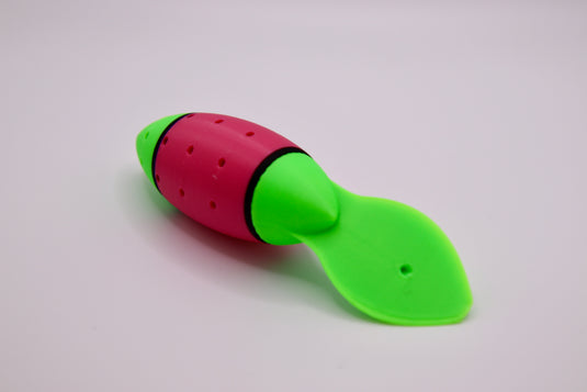 Salmon fishing lure in green, pink, and black from the side - great for chinook salmon and coho salmon